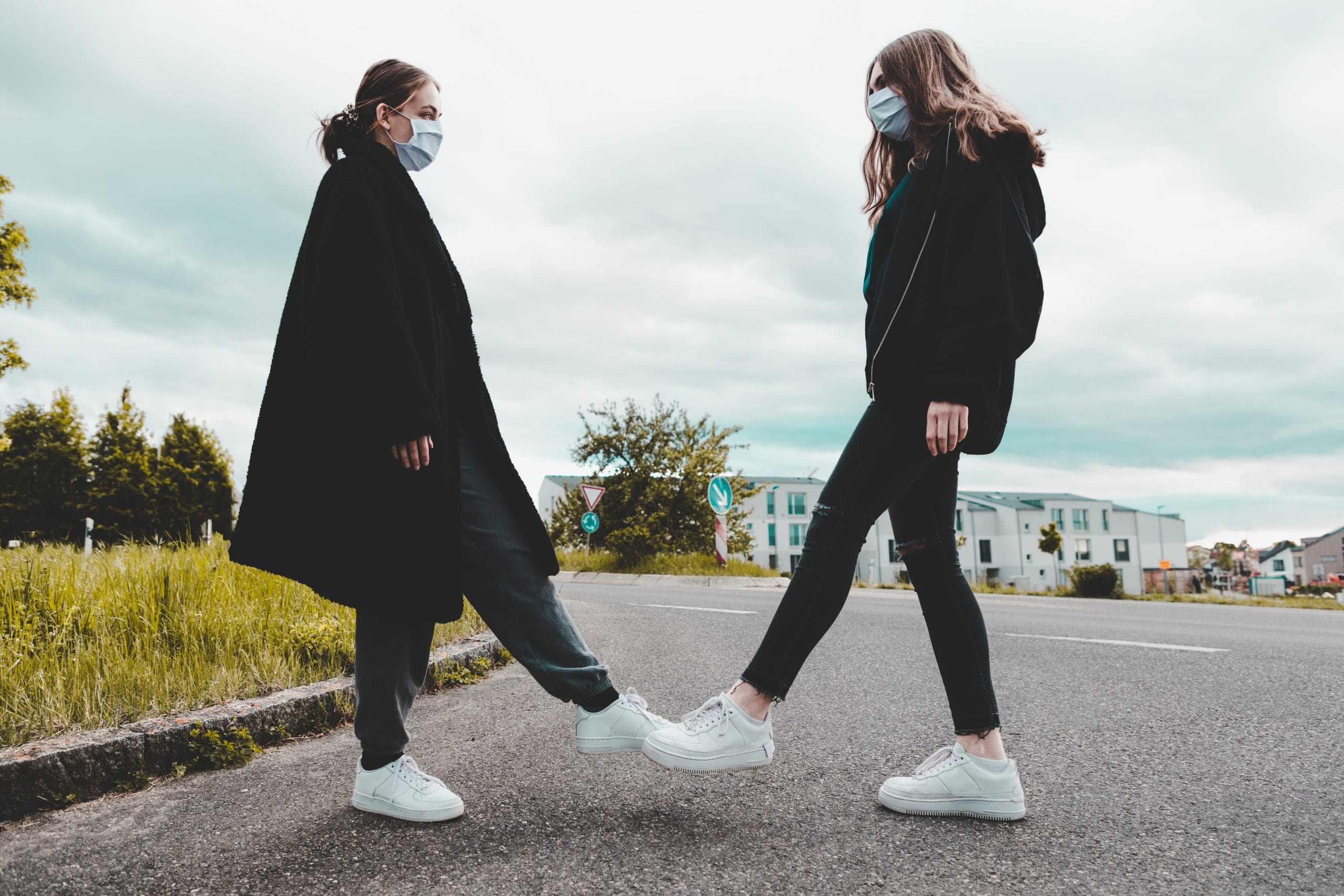 Teenage Girls Foot Bump Corona Covid-19 Pandemic Times