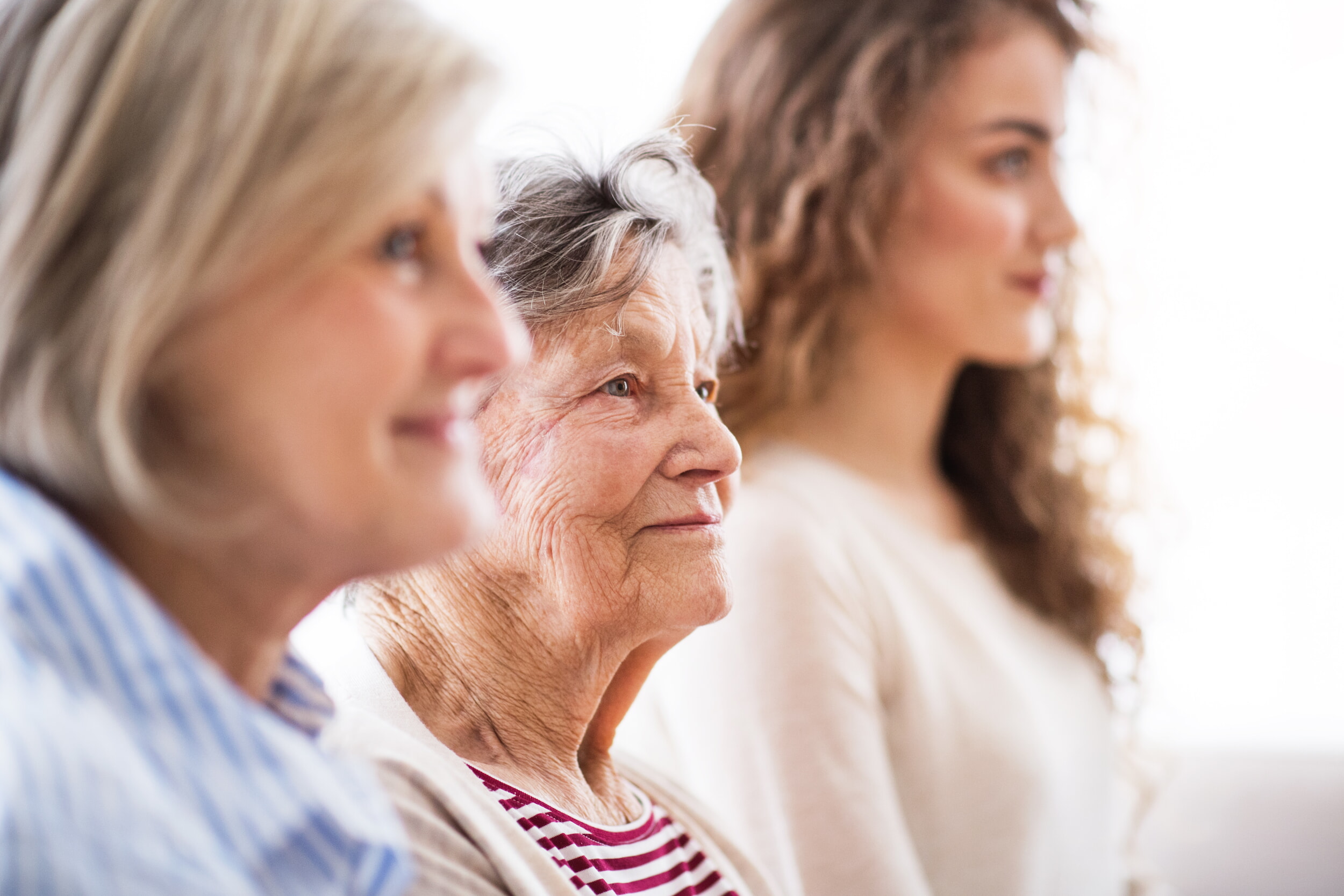 A Teenage Girl With Mother And Grandmother At Home.