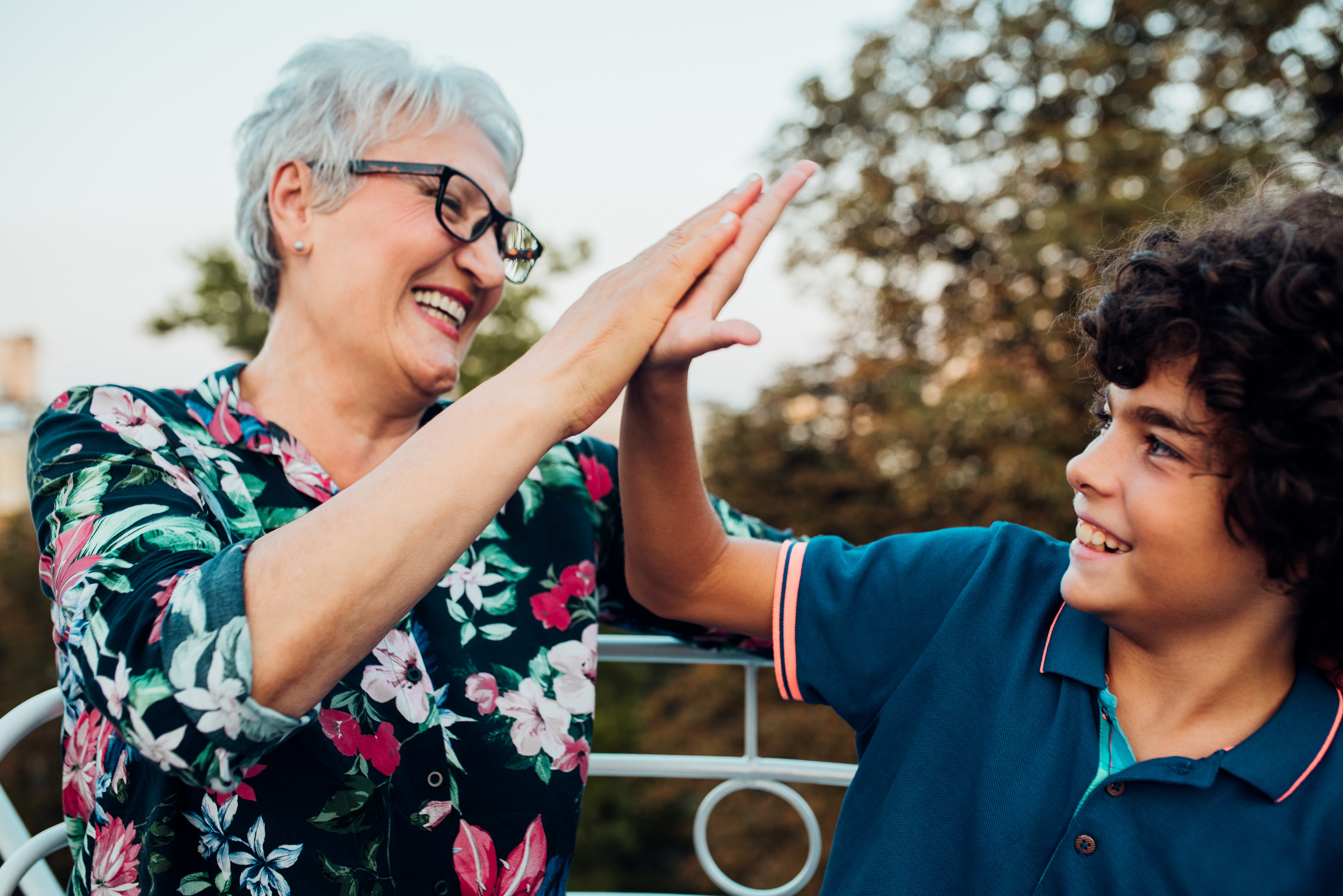 Boy And His Grandma Having Fun At The Amusement Park